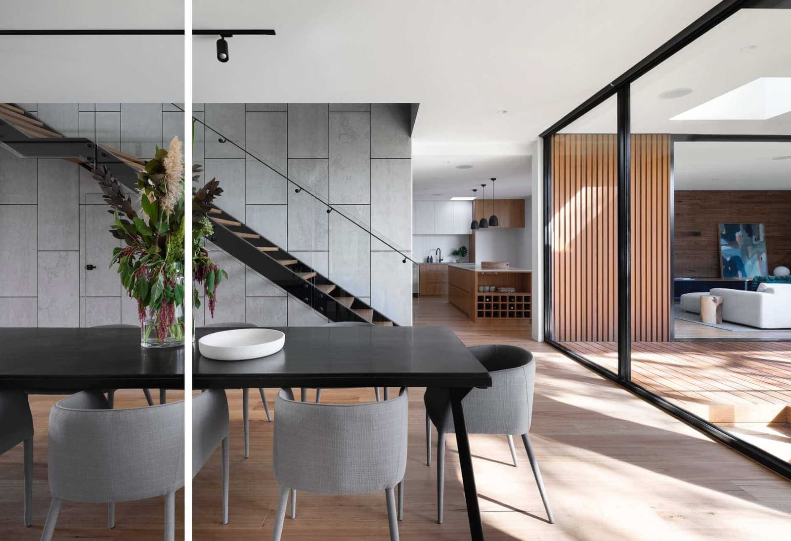 Completed open-plan interior with structural glass and steel staircase