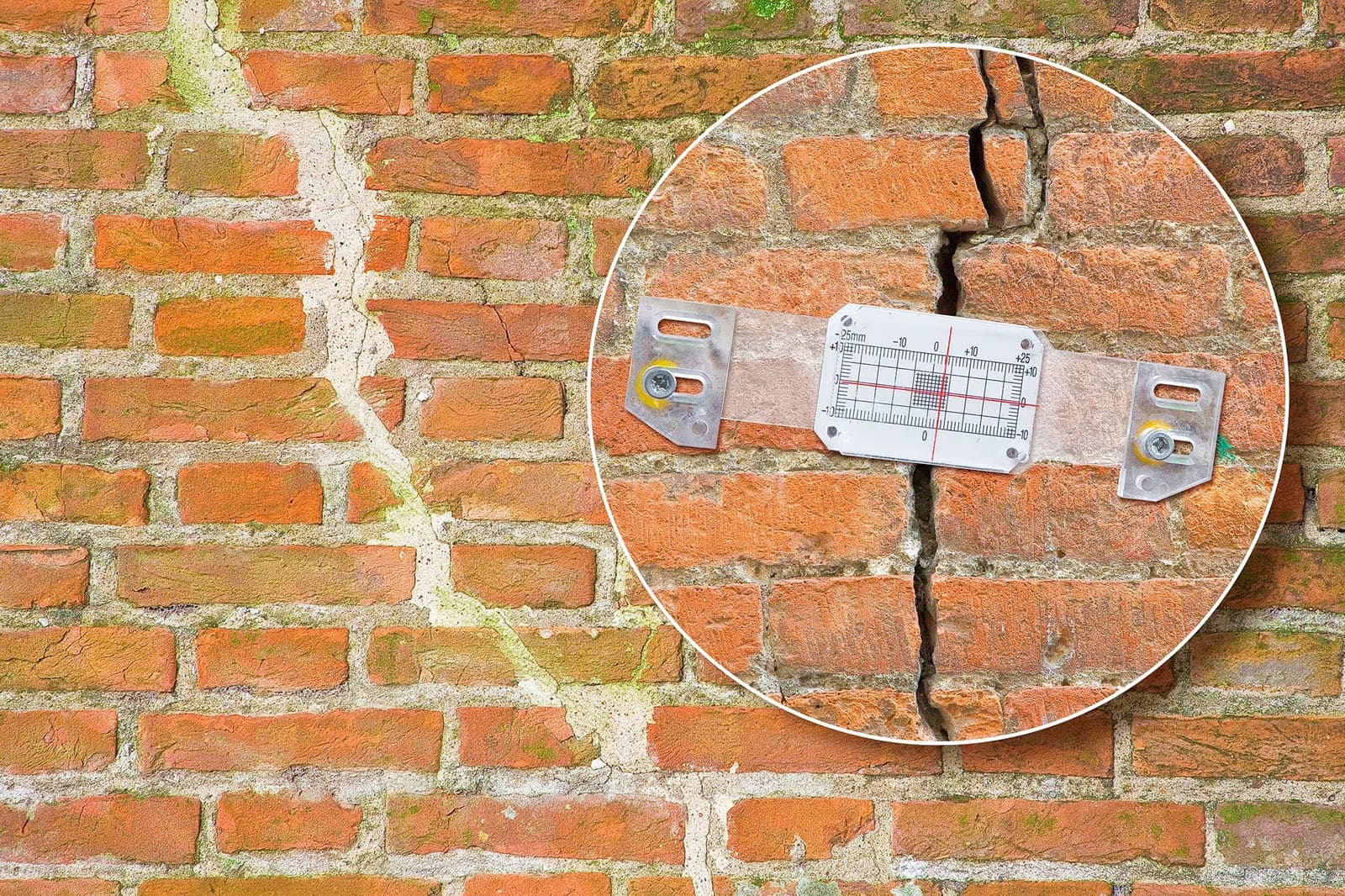 Crack monitoring gauge fitted across stepped cracking in a brick wall during a structural survey